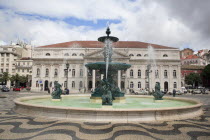 Portugal, Lisbon, Fountain in Rossio Square with the Sao Carlo Opera House in the background.