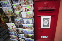 Portugal, Lisbon, Souvenir tiles for sale beside a postbox.