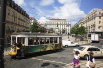 Portugal, Lisbon, Praca Luis de Camoes square with electrified tram passing.