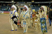 Canada Alberta Lethbridge, International Peace Pow Wow Grand Entry, Blackfoot Indian Chiefs from Canada in buckskins and eagle feather war bonnets.