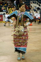 Canada, Alberta, Lethbridge, International Peace Pow Wow, North American Indian in Ladies Jingle Dance competition.