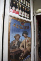 Portugal, Lisbon, A Ginjinha cherry liqueur bar sign.