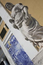 Portugal, Lisbon, Statue & azulejo in Eduardo VII Park.