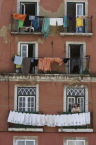 Portugal, Lisbon, Laundry drying on balconies of a town house in the Alfama district.