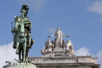 Portugal, Lisbon, Statue of King Jose 1 in Praca do Comercio with the Triumph Arch in the background.