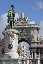 Portugal, Lisbon, Statue of King Jose 1 & the Triumph Arch in Praca do Comercio.