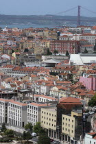 Portugal, Lisbon, View over the Baixa district with 25 April Bridge in the background.
