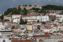 Portugal, Lisbon, View across the Baixa district to Sao Jorge castle.