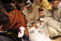 India, Uttarakhand, Hardiwar, Group of men playing.