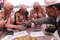 India, Uttarakhand, Hardiwar, Pilgrims on the bank of the Ganges during Kumbh Mela, Indias biggest religious festival where many different traditions of Hinduism come together to bathe in the Ganges.