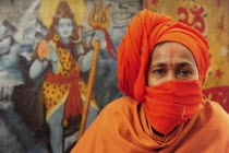 India, Uttarakhand, Hardiwar, Portrait of pilgrim at Kumbh Mela, Indias biggest religious festival where many different traditions of Hinduism come together to bathe in the Ganges.