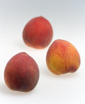 Food, Fruit, Peach, Three ripe red peaches Prunus persica.