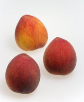 Food, Fruit, Peach, Three ripe red peaches Prunus persica.