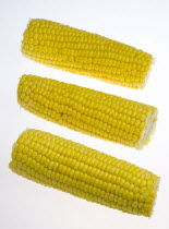 Food, Vegetables, Sweet Corn, Three ripe harvested yellow sweetcorn cobs.