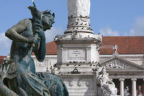 Portugal, Estremadura, Lisbon, Fountain statue in Rossio Square with the Opera Theatre in the background.