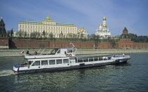 Russia, Moscow, Kremlin, Cathedral of the Archangel, and Tourist Boat, on Mostva Mockba River.
