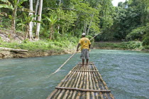 Jamaica,  Cornwall County, Rafting down the Martha Brae River on bamboo rafts towards Falmouth.