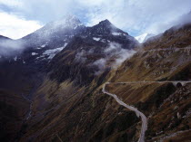 Switzerland, Meiental, East side of Susten Pass across steep mountainside with peaks of Sustenspitz at 2930 metres in centre and Chli Sustenhorn at 3309 metres centre left.