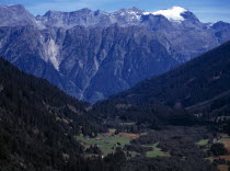 Switzerland, Ticino , Dotra, Scattered settlement of Dotra with snow glacier of Rheinwaldhorn mountain beyond 3402 metres.