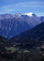Switzerland, Ticino , Dotra, Scattered settlement of Dotra with snow glacier of Rheinwaldhorn mountain beyond 3402 metres.