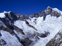 Switzerland, Valais, Aletsch Glacier, Aletschhorn 4195 metres against sky on right and Geisshorn 3740 metres left with Mittel aletschgletscher tongue running diagonally right and left.