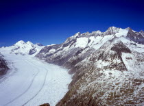 Switzerland, Valais, Aletsch Glacier, Aletschgletscher with from left to right peaks of Monch 4099 metres Trugberg 3933 metres Eiger 3970 metres and part view of Wannenhorn 3906 metres.