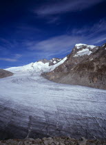 Switzerland, Valais, Rhone Glacier, Upper Rhone glacier from the Nagelisgratei Path with highpoint of Galenstock at 3586 metres. High windswept cloud in blue sky above.