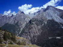 Switzerland, Zermatt, Mattertal, View towards west side of snow topped peak of Dom the highest mountain within the Swiss boundary and Taschhorn from Schaferhuttli chalet.