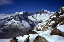 Switzerland, Valais, Jungfrau-Aletsch , Aletschhorn with Mittelaletschgletscher spilling down the south face snow and rocks on the Eggishorn in the foreground.