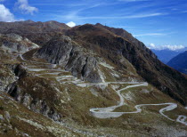 Switzerland, Ticino, The original cobble surface snaking mountain road from Airolo to St Gottard Pass viewed from the west.