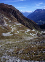Switzerland, Ticino, The original cobble surface snaking mountain road from Airolo to St Gottard Pass viewed from the west.