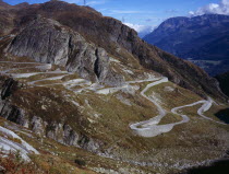 Switzerland, Ticino, The original cobble surface snaking mountain road from Airolo to St Gottard Pass viewed from the west.