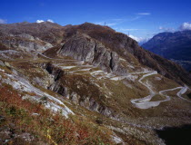 Switzerland, Ticino, The original cobble surface snaking mountain road from Airolo to St Gottard Pass viewed from the west.