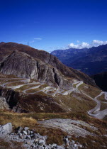 Switzerland, Ticino, The original cobble surface snaking mountain road from Airolo to St Gottard Pass viewed from the west.