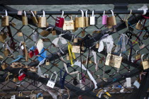 France, Ile de Fance, Paris, Padlocks attached to Pont des Arts that according to tradition the lock is a statement of a couples eternal love.