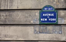 France, Ile de France, Paris, Typical Parisian street sign on old building wall with the Avenue de New York street name written on it.