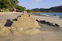 Mexico, Guerrero, Zihuatanejo, Playa la Ropa, sandcastle on the beach.