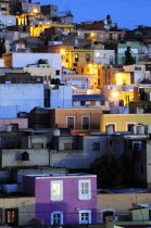 Mexico, Bajio, Zacatecas, Colourful housing across the hillside at night.