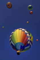 USA, New Mexico, Albuquerque, Annual balloon fiesta, Colourful hot air balloons ascending.