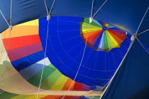 USA, New Mexico, Albuquerque, Annual balloon fiesta, Colourful hot air balloon being inflated.