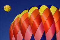 USA, New Mexico, Albuquerque, Annual balloon fiesta, Colourful hot air balloons in flight.