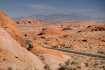 USA, Nevada, Valley of Fire State Park, road winding through the red rocky landscape.