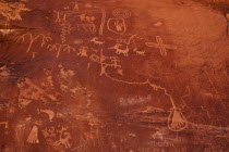 USA, Nevada, Valley of Fire State Park, petroglyph carved into red rock.