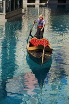 USA, Nevada, Las Vegas, The Strip, gondola outside side the entrance to the Venetian hotel and casino.