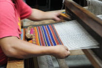 Mexico, Oaxaca, Carpet weaving at La Mano Magica by Tomas Mendoza.