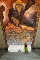 Mexico, Jalisco, Guadalajara; Palacio Gobierno or Government Palace, Mural of Fr Miguel Hidalgo by Jose Orozco in 1937, with staircase & figure.