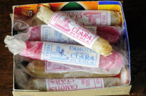 Mexico, Puebla, Box of coloured camotes or candied yam.