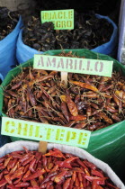 Mexico, Oaxaca, Sacks of dried dried chillies for sale in the market.