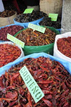 Mexico, Oaxaca, Sacks of dried chillies for sale in the market.