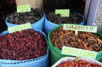 Mexico, Oaxaca, Sackes of dried chillies for sale in the market.